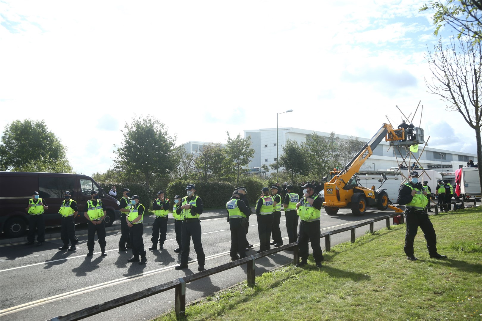 Police formed a cordon as emergency services used a cherry picker to remove protesters at Broxbourne, Hertfordshire (Yui Mok/PA)