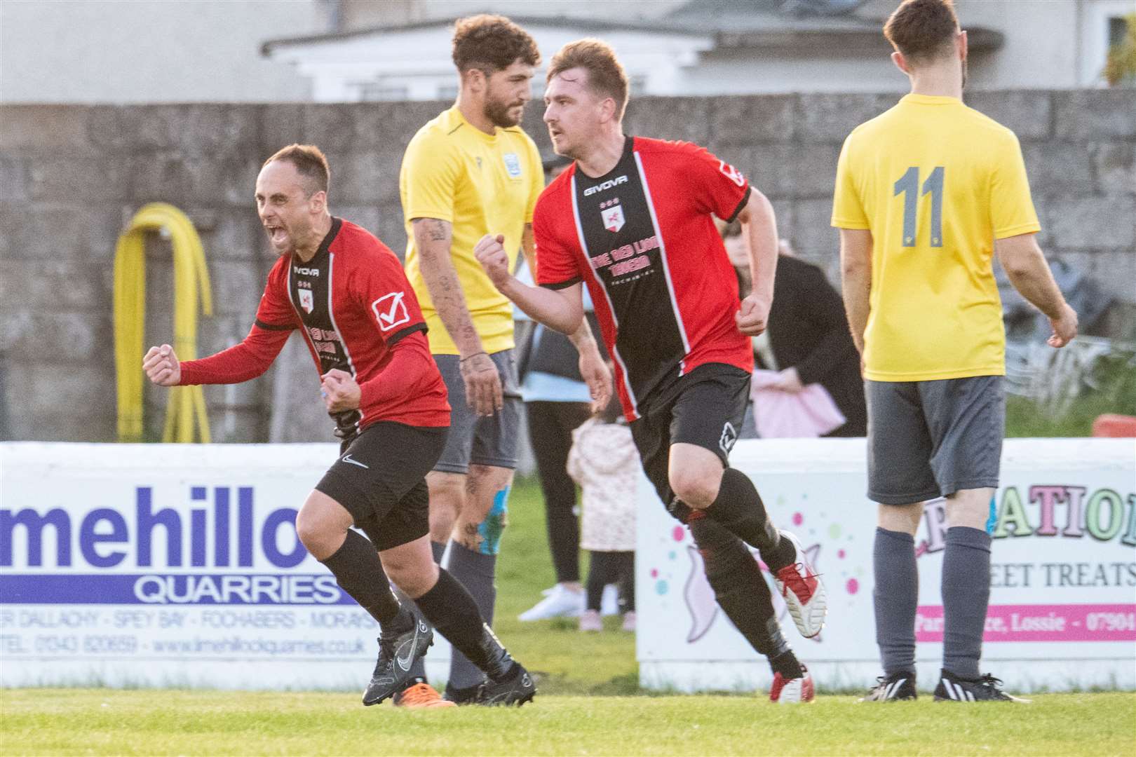 Fochabers player-manager Gary Burchell (left) celebrates his first goal of the evening. ..Fochabers FC (7) vs Hopeman FC (2) - Mike Simpson Cup Final 2023 - Grant Park, Lossiemouth...Picture: Daniel Forsyth..