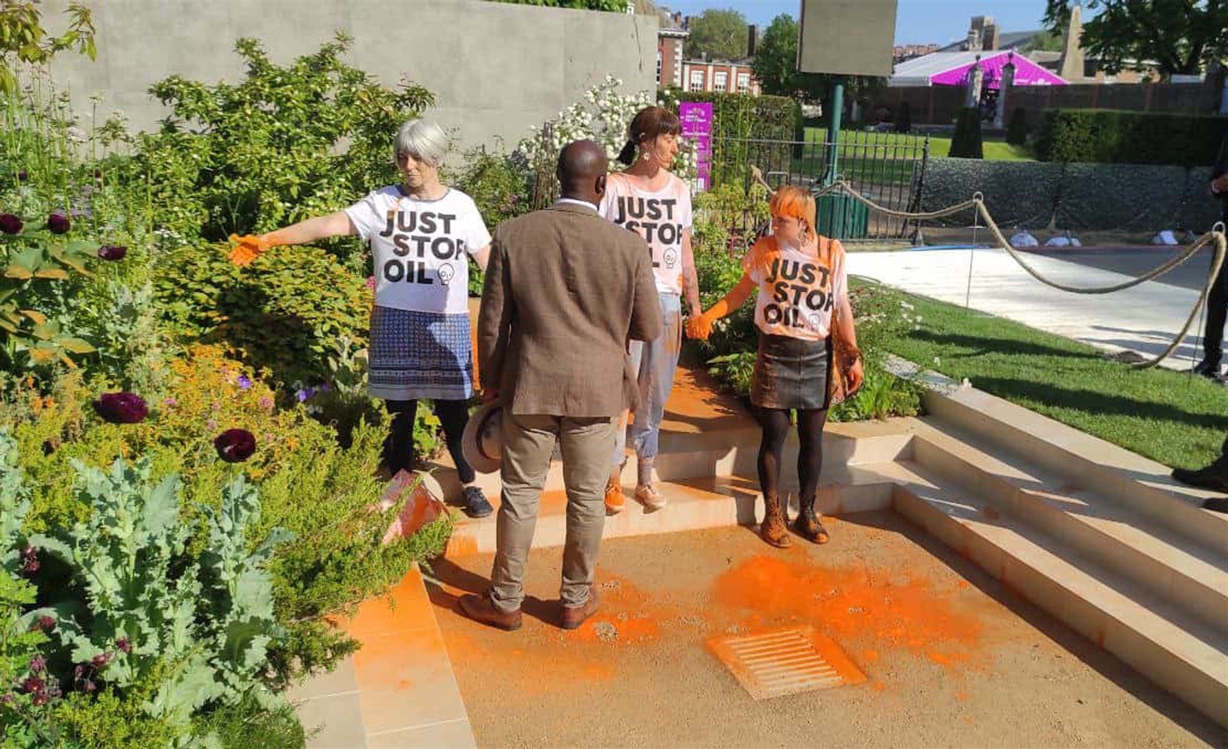 Three protesters at Chelsea Flower Show who have been arrested on suspicion of criminal damage in connection with a Just Stop Oil protest (Just Stop Oil/PA)