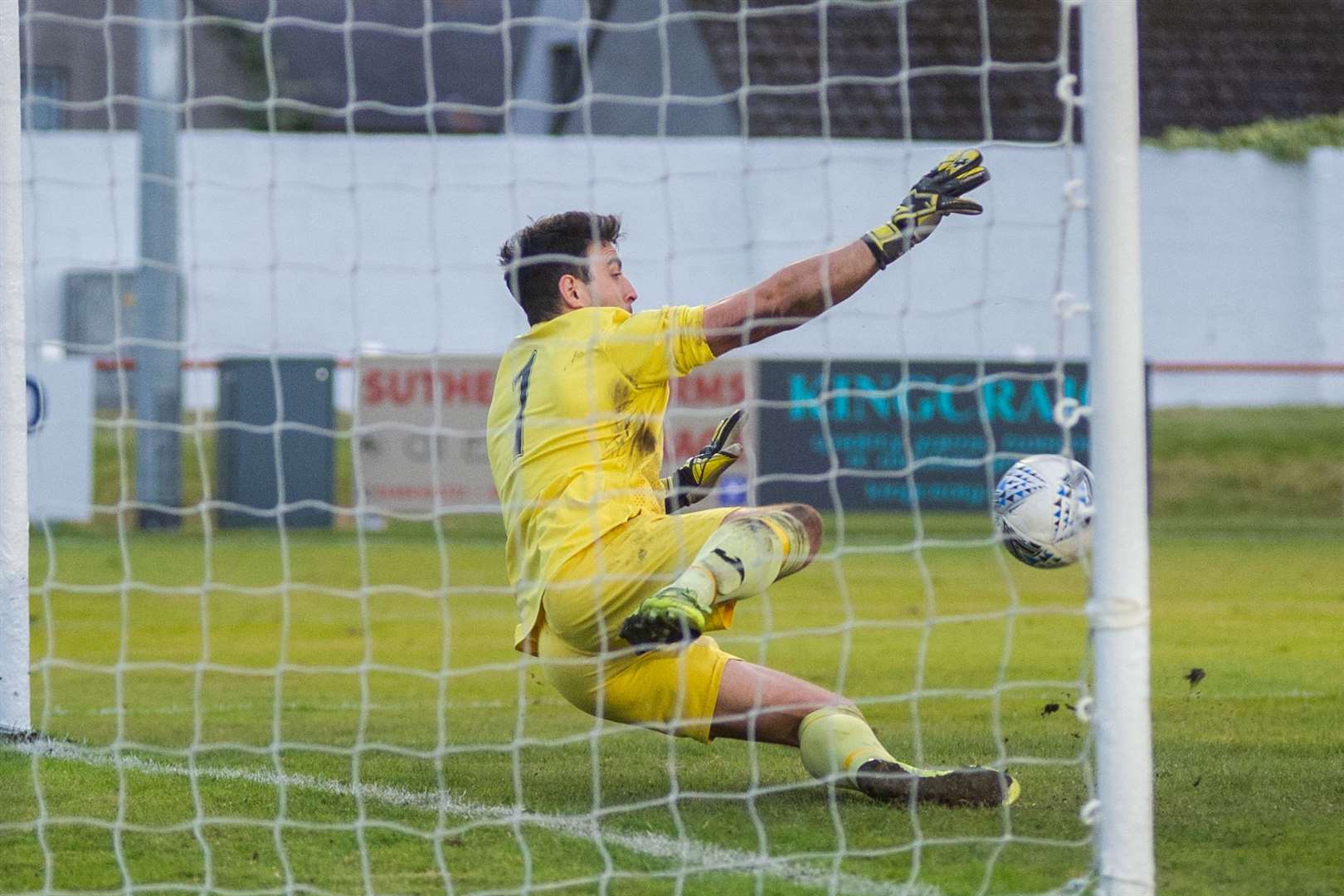 Buckie Thistle goalkeeper Daniel Bell saves Gregor MacDonald's penalty. ..Picture: Daniel Forsyth..