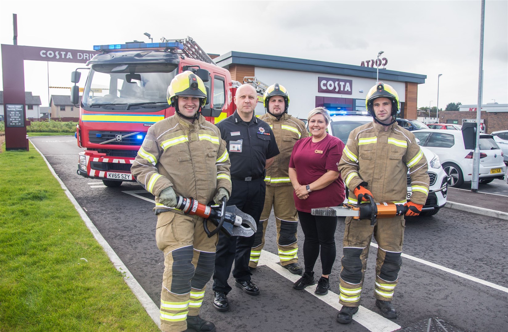 Preparing for Saturday morning's road safety event at Costa Coffee's Drive Thru in Elgin are (from left) firefighter Ryan Calder, station commander David Scott, Costa manager Lisa Smith, crew manager Douglas McAulay and crew member Steven Ellis. Picture: Becky Saunderson.
