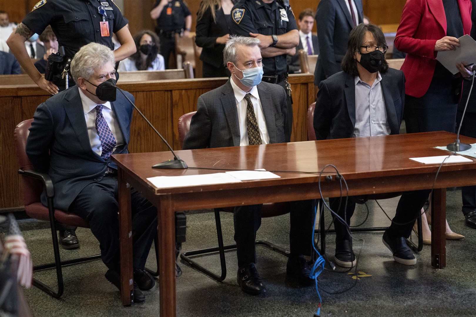 Glenn Horowitz (left), Craig Inciardi and Edward Kosinski appear in criminal court after being indicted for conspiracy involving handwritten notes from the famous Eagles album (John Minchillo/AP)