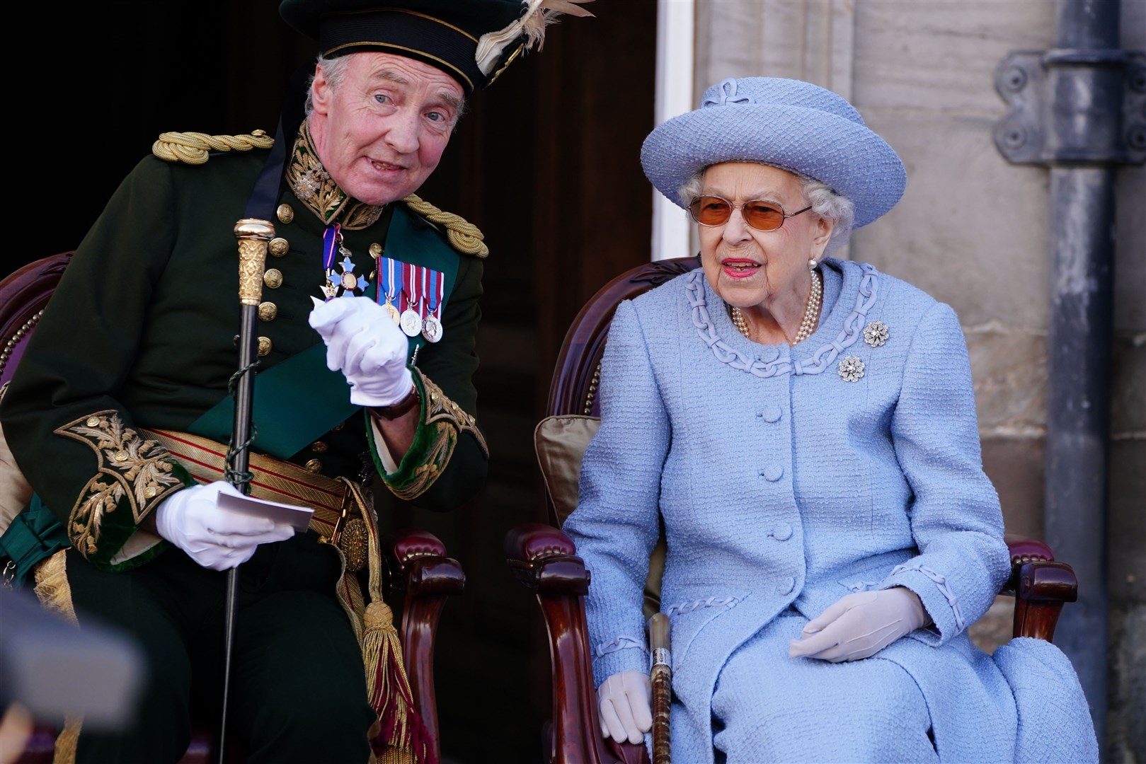 The Duke of Buccleuch pointed out a detail to the Queen at a parade for the Royal Company of Archers at Holyroodhouse, Edinburgh, in June (Jane Barlow/PA)