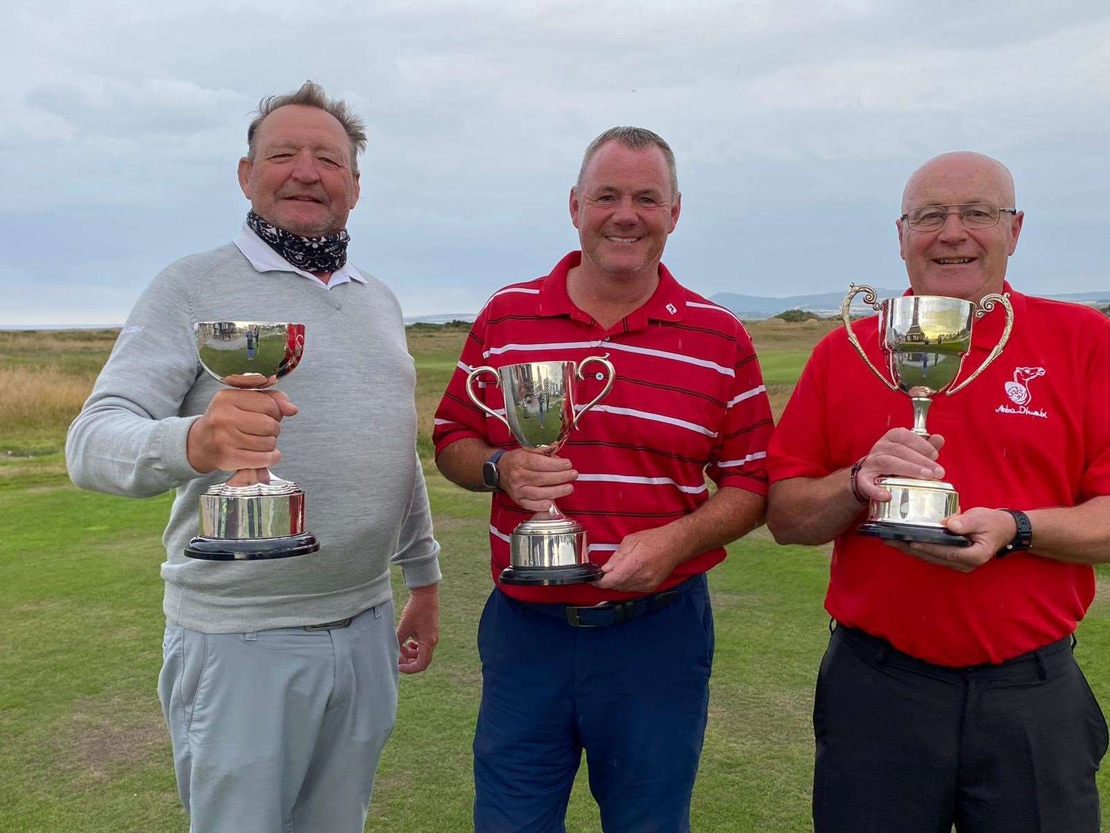 Celebrating their victories are trophy winners (from left) Alf Bryce-Maynard, Richard Cormack and Dougie Cruickshank. Picture: Spey Bay Golf Club