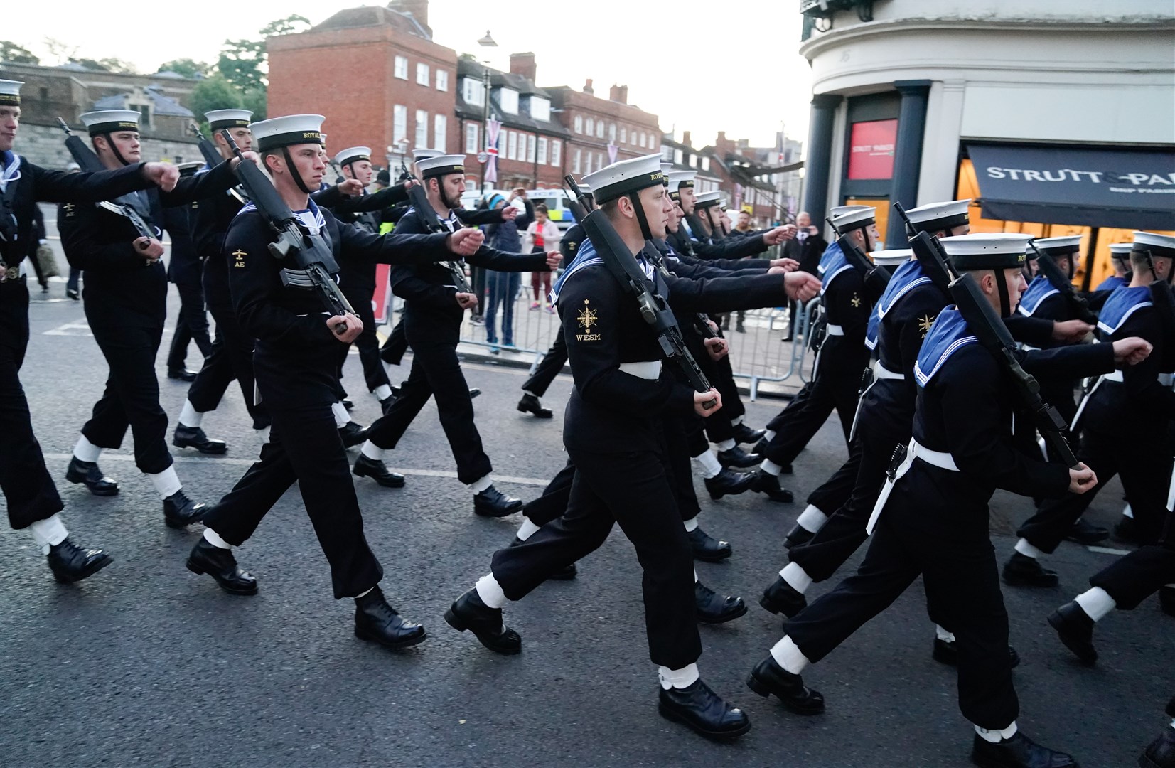Members of the Royal Navy marched towards Victoria barracks (Andrew Matthews/PA)