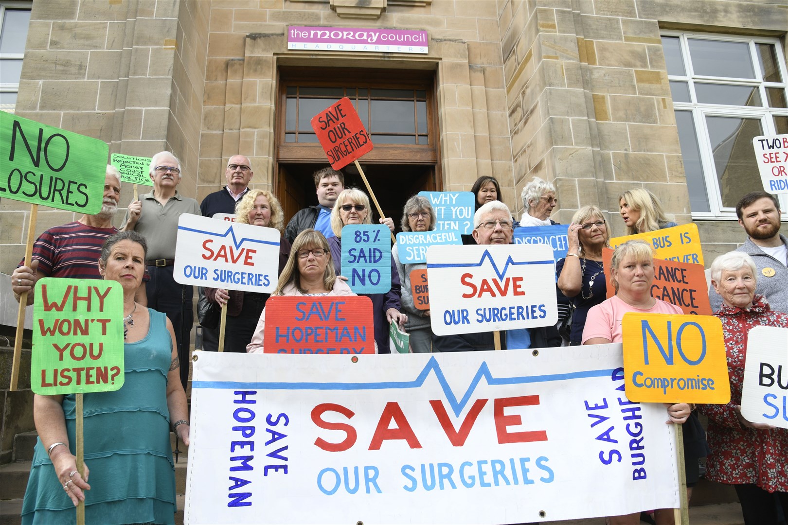 Protestors from Hopeman and Burghead gathered outside Moray Council's HQ on Thursday morning. Picture: Daniel Forsyth