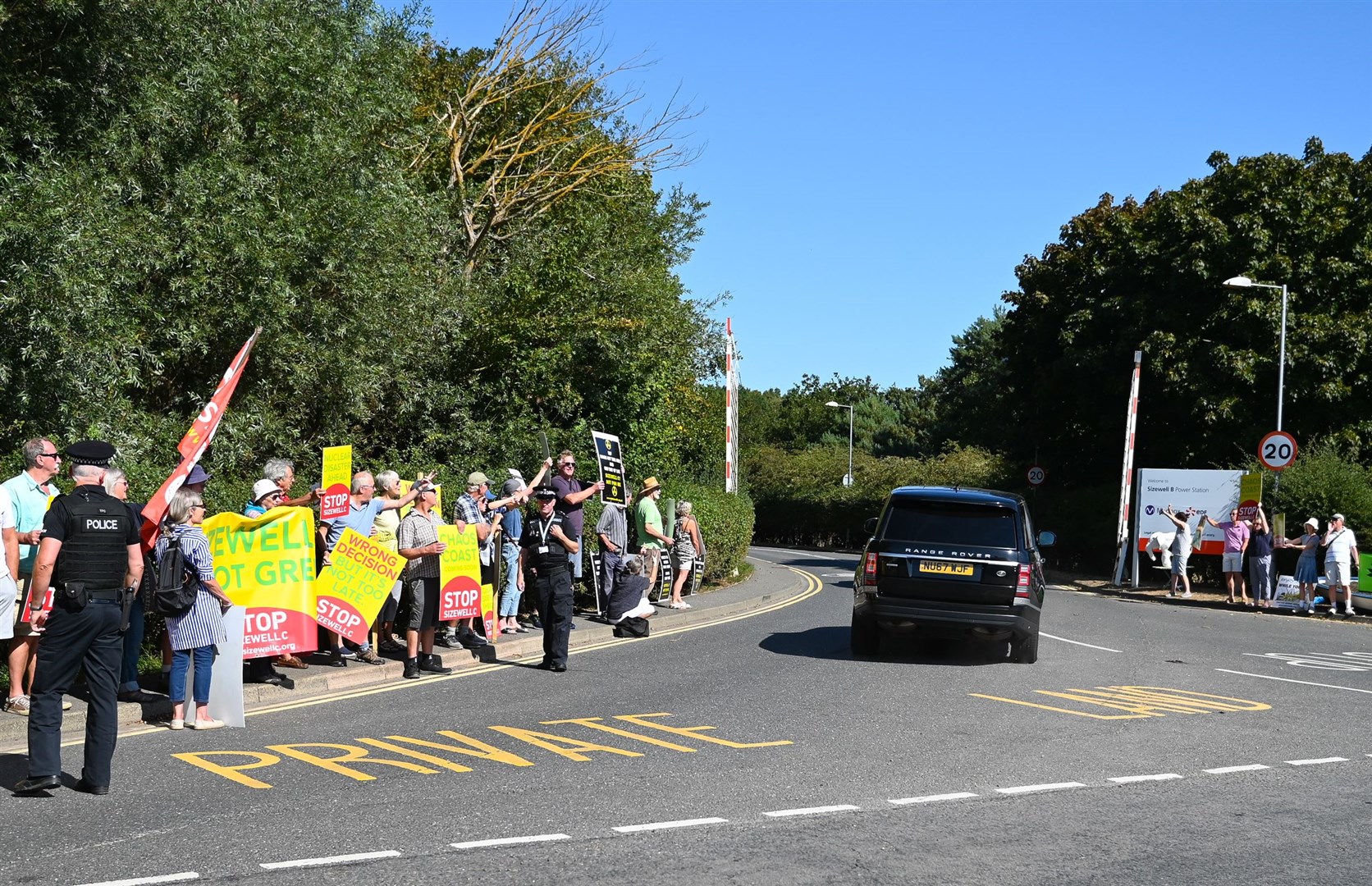 Protesters from the Stop Sizewell C and Together Against Sizewell C campaign groups protest outside as Boris Johnson visits (Gregg Brown/PA)