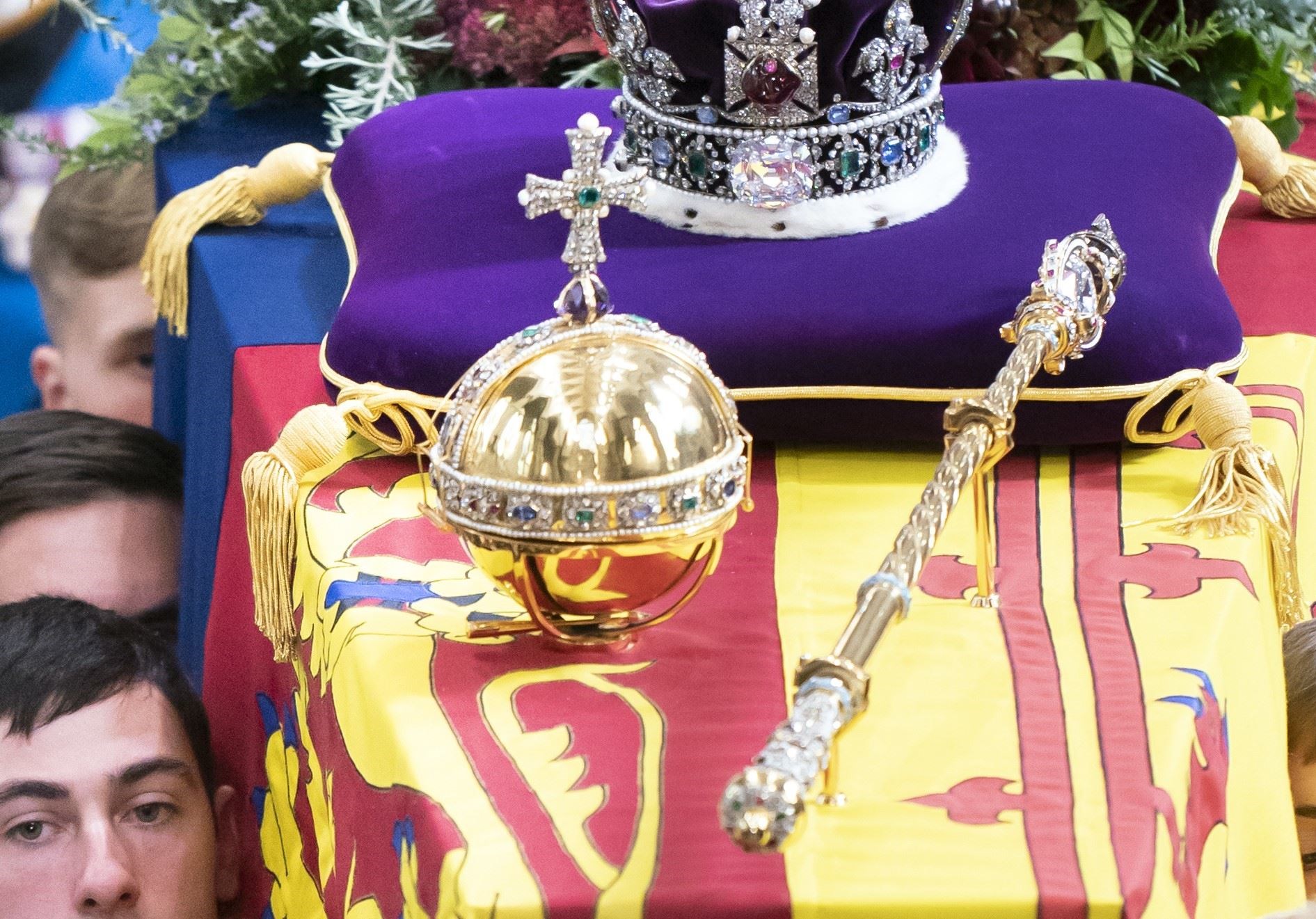 The Sovereign’s Orb with the Sovereign’s Sceptre with Cross and Imperial State Crown on Elizabeth II’s coffin (PA)