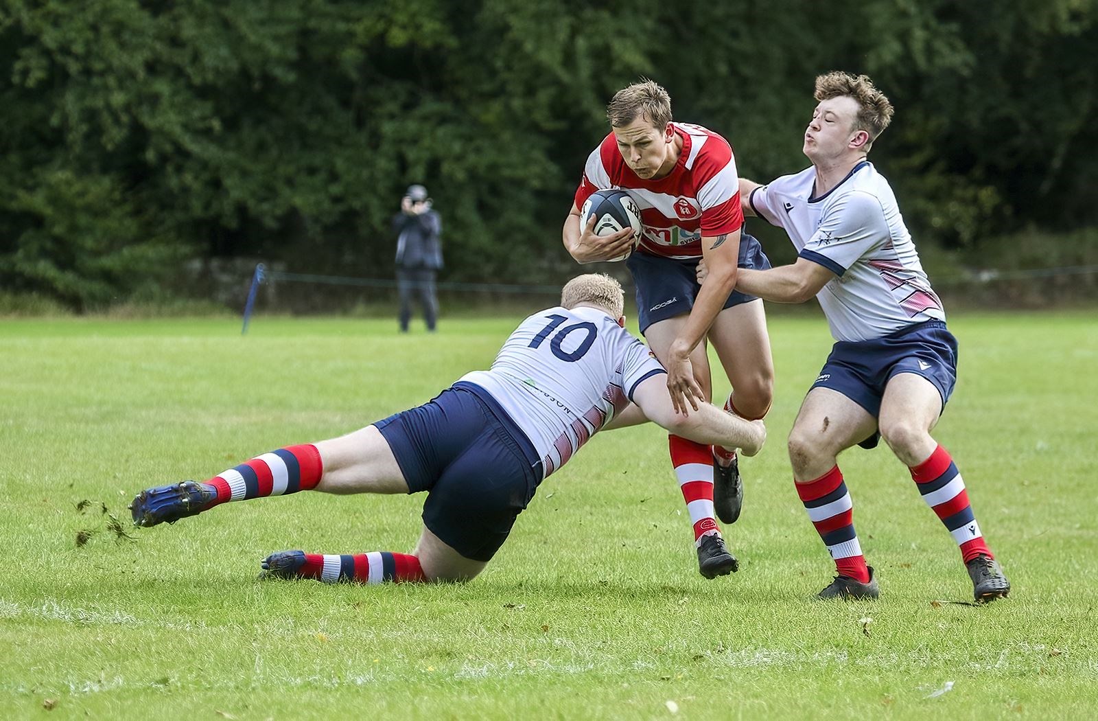 Cameron Ireland being tackled by two defenders. Picture: John MacGregor