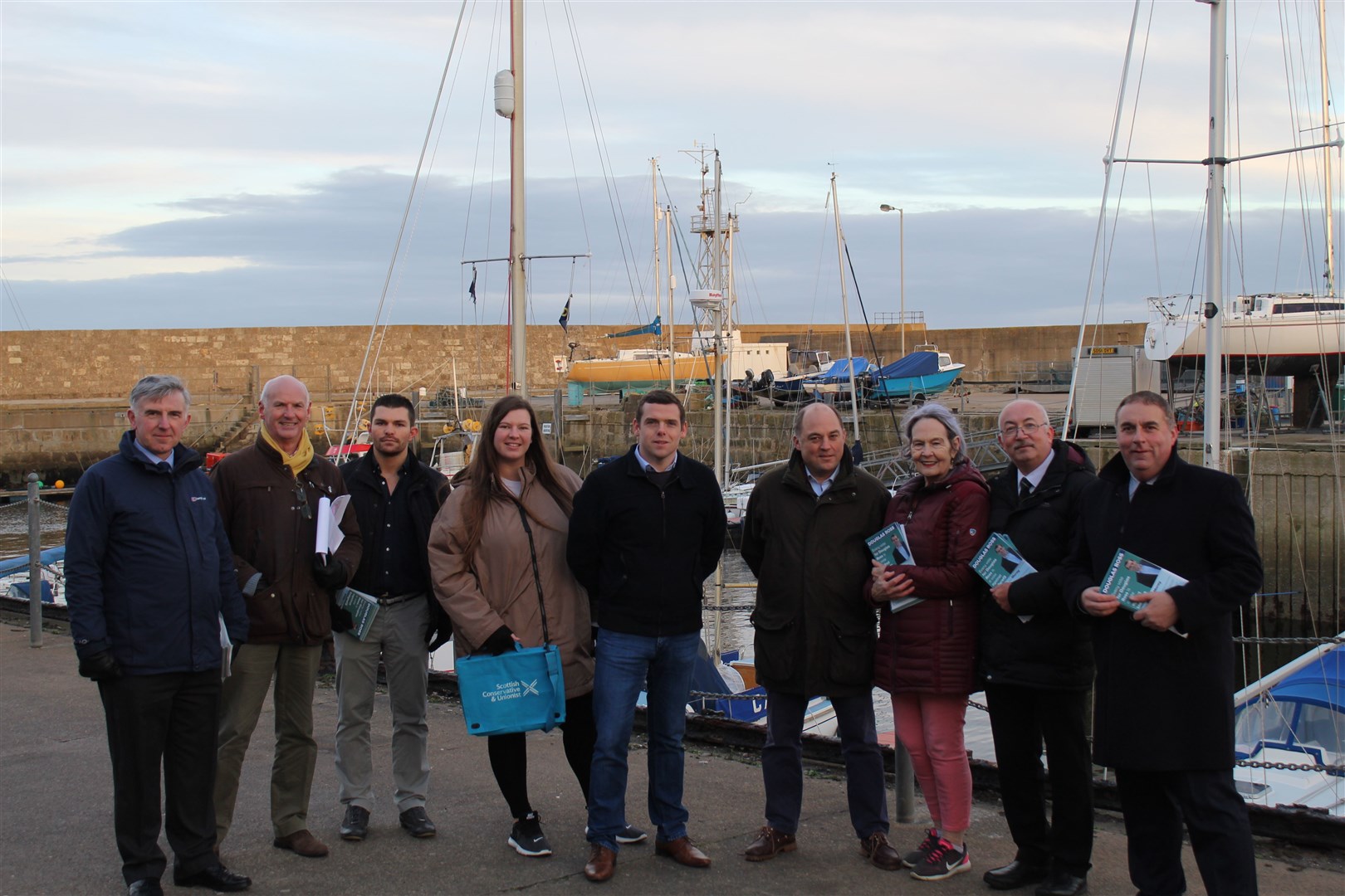 Douglas Ross (fifth from left) and Defence Secretary Ben Wallace (fourth from right) with campaigners in Lossiemouth.