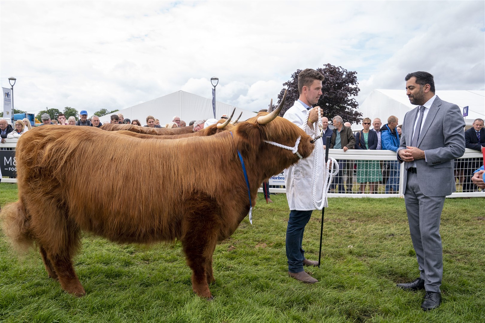 Humza Yousaf meets a competitor in the cattle ring at the Royal Highland Show (Jane Barlow/PA)
