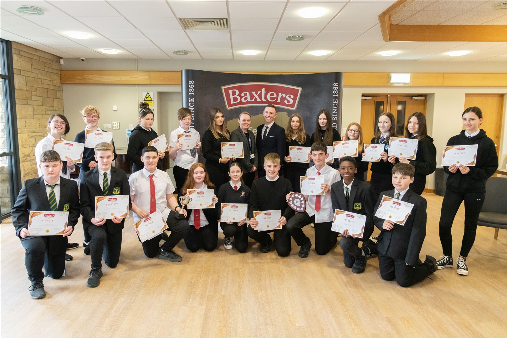 Sandy Young, Human Resources Advisor at Baxters, and Carinne Taylor, School Coordinator at DYW, with the finalists from the five schools. Picture: Beth Taylor