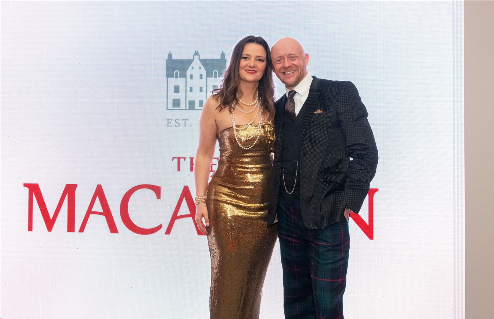 Chairman George McNeil with his wife, Laura McNeil. Spirit of Speyside Whisky Festival Opening Dinner 2024 held at The Macallan Distillery Estate. Picture: Beth Taylor