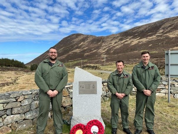 The three RAF Lossiemouth 8 Squadron members at the cairn, from left, Sqn Ldr Bracewell, Flt Lt Jobin and Flt Lt Smith.