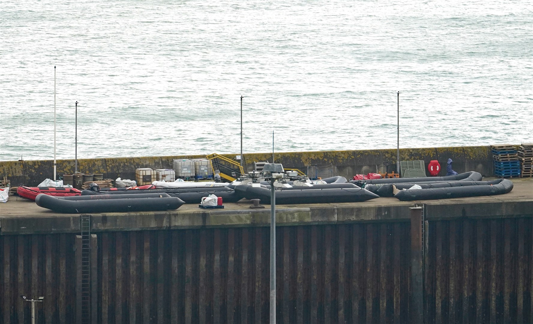Boats used in previous crossings on the quayside after a group of people thought to be migrants are brought in to Dover (Gareth Fuller/PA)