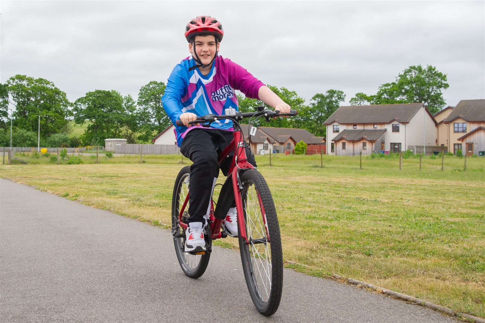 Elgin's Rory Dey has been fundraising for Outfit Moray after they helped and taught him how to ride a bike. Picture: Daniel Forsyth..