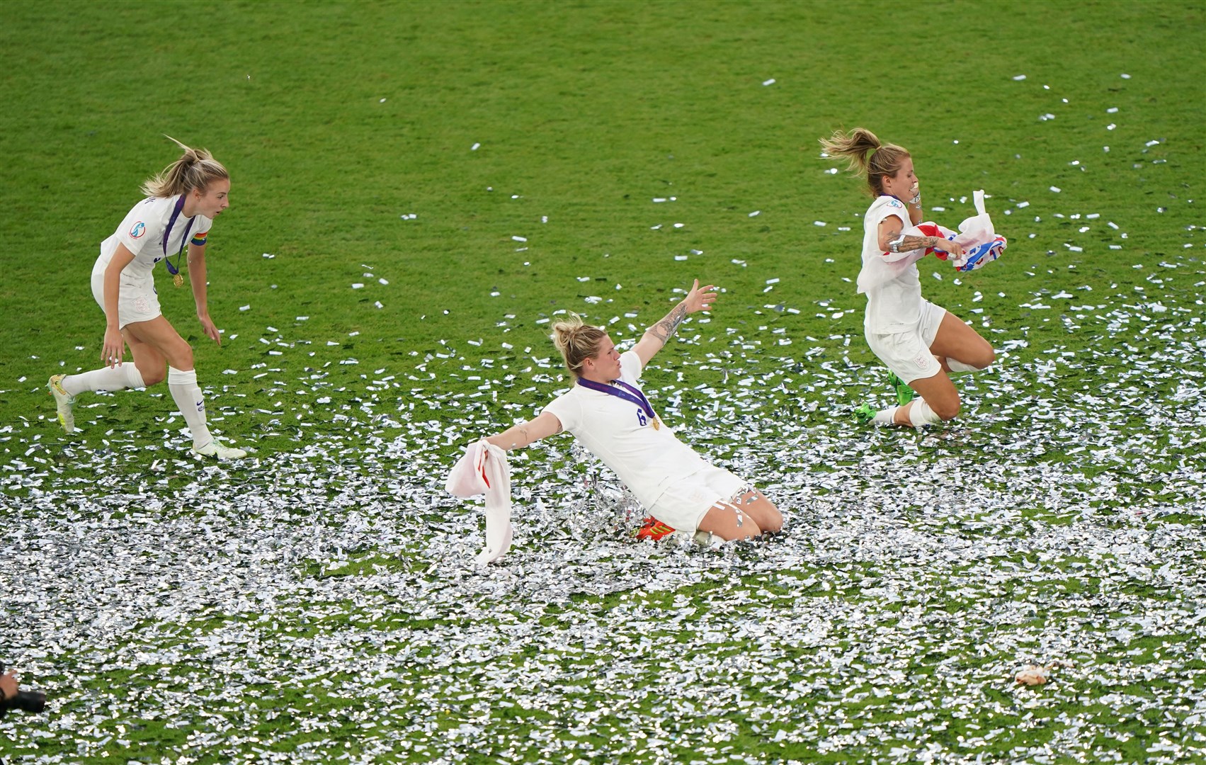 England’s Leah Williamson, Millie Bright and Rachel Daly celebrate (Joe Giddens/PA).