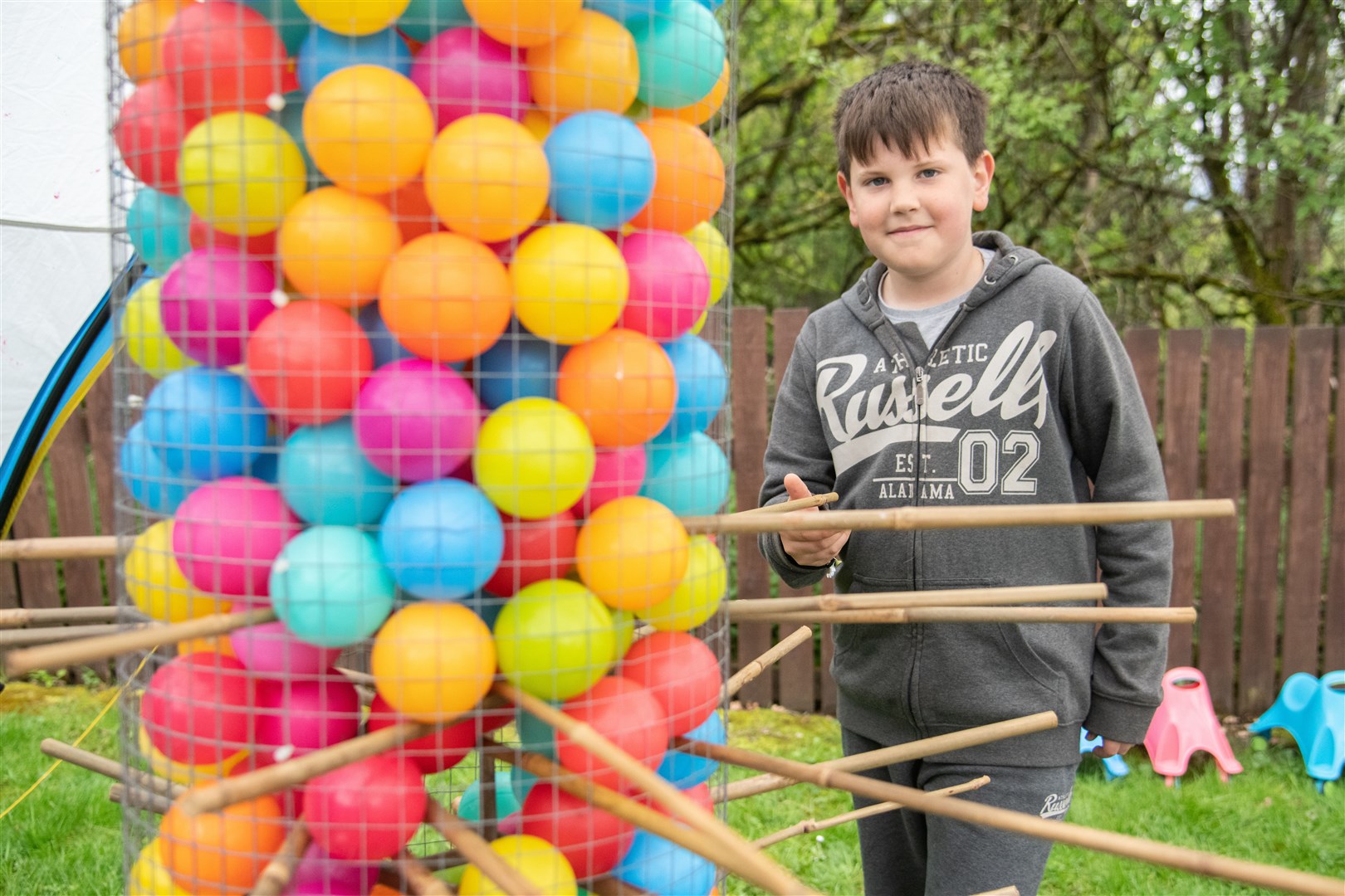 Matthew Bowcutt plays one of the games in the community garden. Picture: Daniel Forsyth