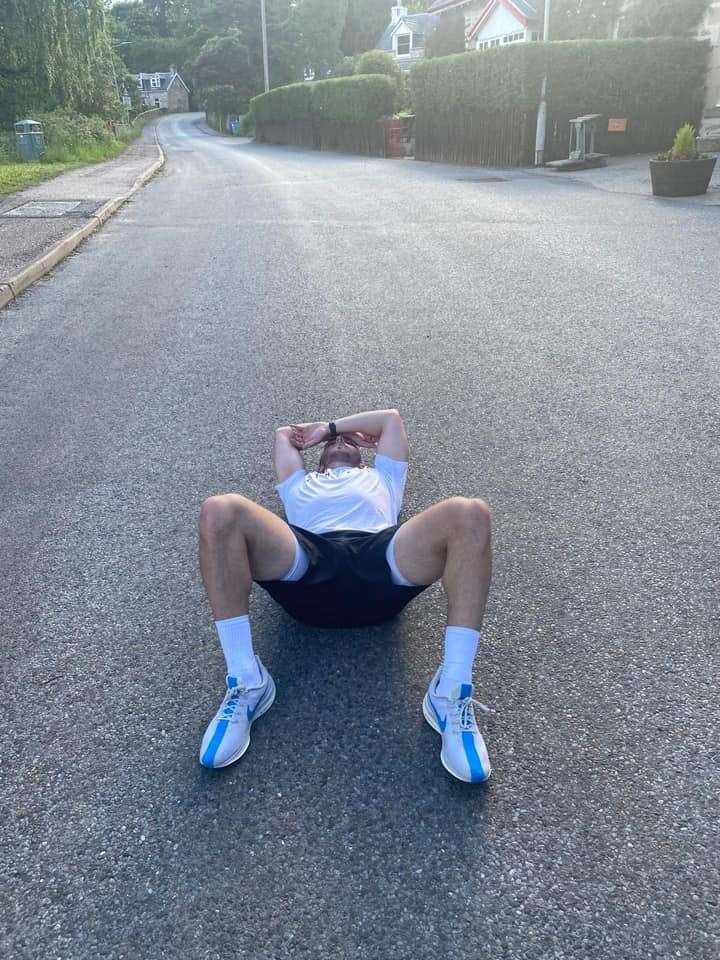 Sam Morrison is flat out after completing the final leg of the Buckie Thistle 24-hour charity run.