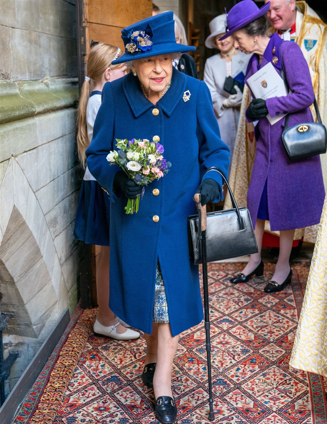 The Queen has been using a stick to aid her walking for much of the year (Arthur Edwards/The Sun/PA)