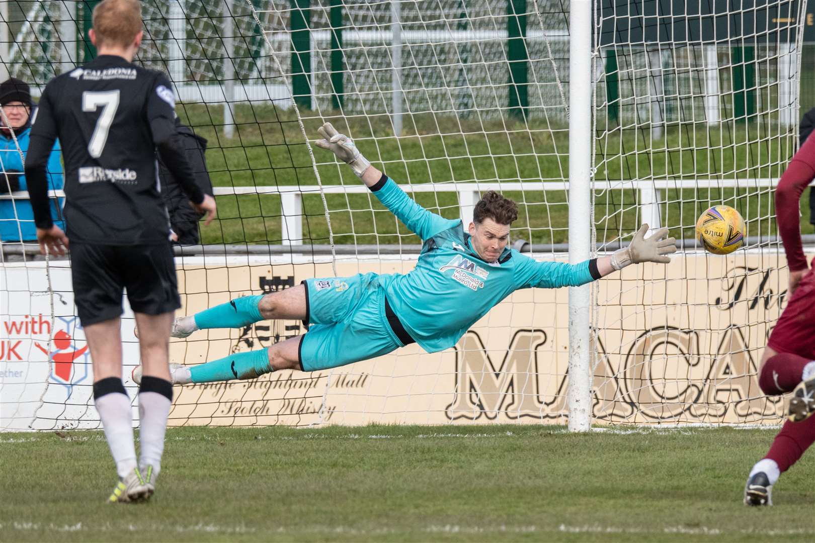 Elgin City keeper Daniel Hoban at full stretch to cover his goal for this free kick. Picture: Daniel Forsyth.