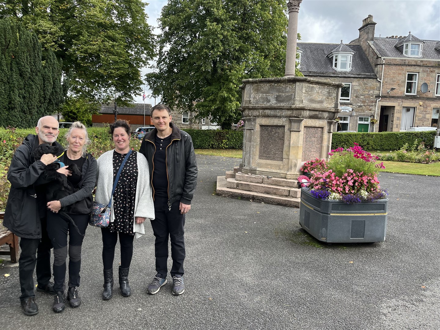 From left, Bruce Williams, Chris Williams, Claire-Louise Battersby and John Battersby were the first members of the public to sign the book in Aberlour today.