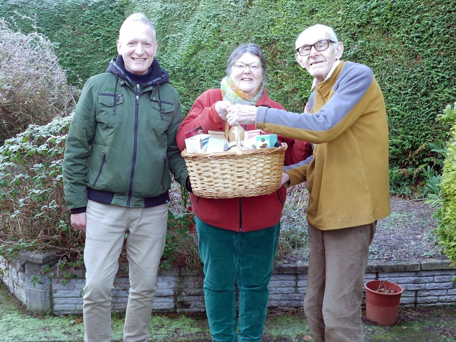 Stephen Coomber, Secretary of the Moray Way Association, and Kath Todd, chairwoman, and presenting Norman Thomson with a gift from the committee. Picture: Lise Olsen