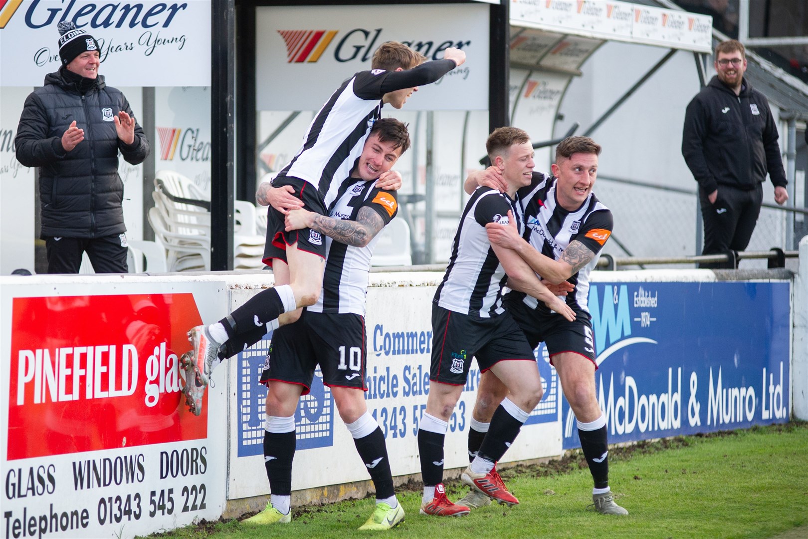Archie Macphee gives hat trick hero Kane Hester a lift during Tuesday’s Elgin City celebrations. Picture: Daniel Forsyth