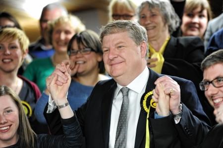Angus Robertson celebrates his win with supporters last night.
