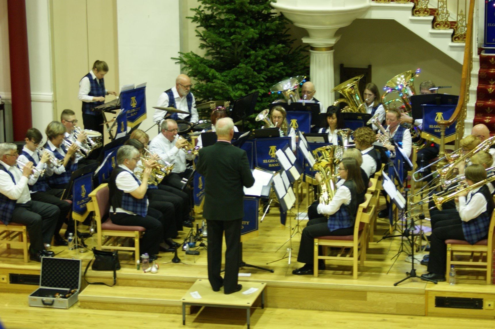 Members of Elgin City Band, led by Bob Garrity, perform at St Giles Church.