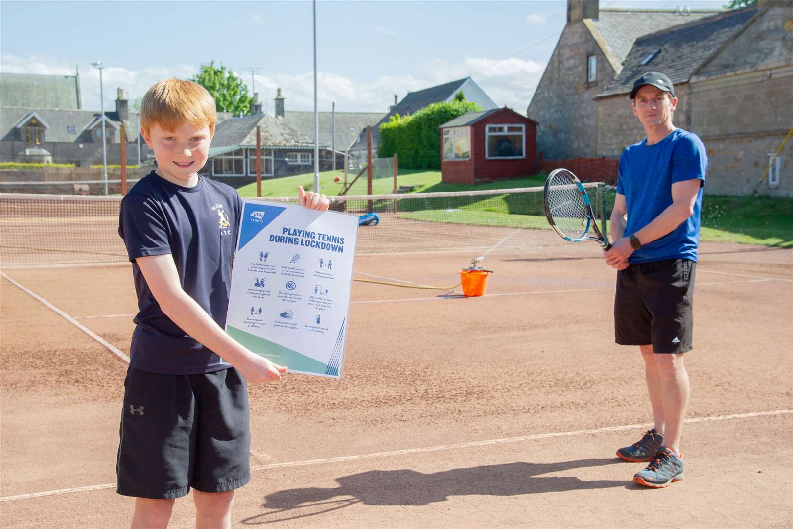 Elgin Tennis Club President Blair Nairn, with son Harris, at the club's Duff Avenue courts ahead of the re-opening of the courts this weekend. Picture: Daniel Forsyth....