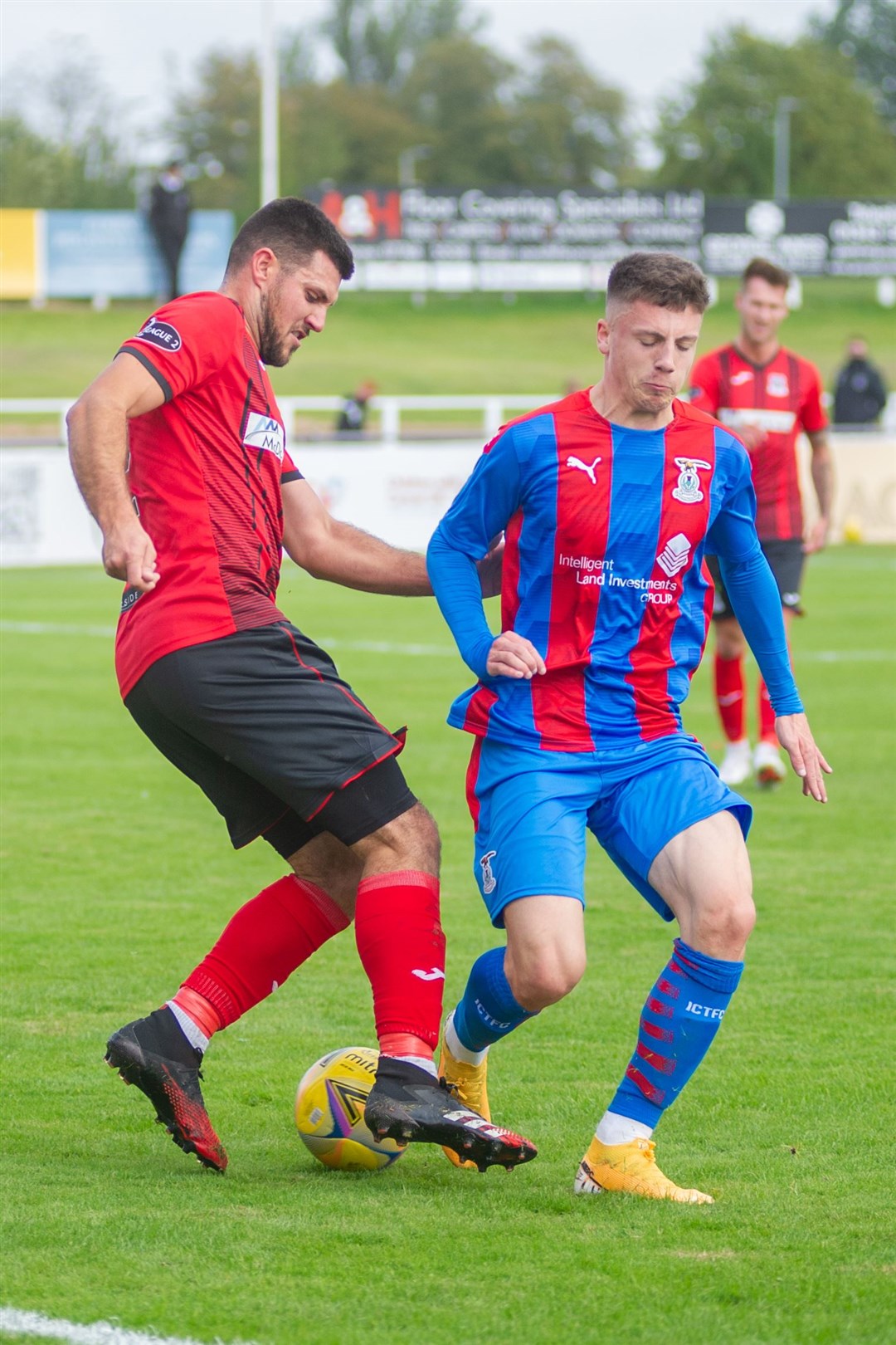 ICT's Daniel Mackay takes on former Elgin team-mate Matthew Cooper during the recent friendly between the clubs. Picture: Daniel Forsyth..