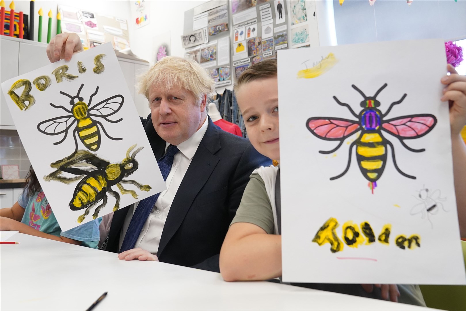 Prime Minister Boris Johnson painted the Manchester Bee during an art class at the city’s HideOut Youth Zone in October 2021 (Stefan Rousseau/PA)