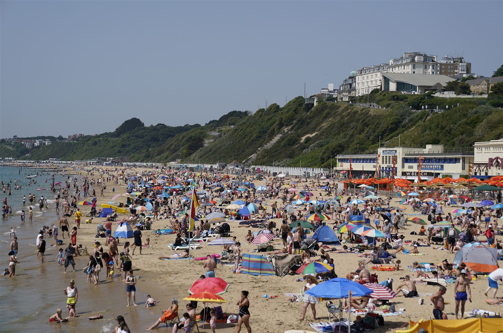 People enjoy the warm weather on Bournemouth beach in Dorset on Friday (Andrew Matthews/PA Wire)