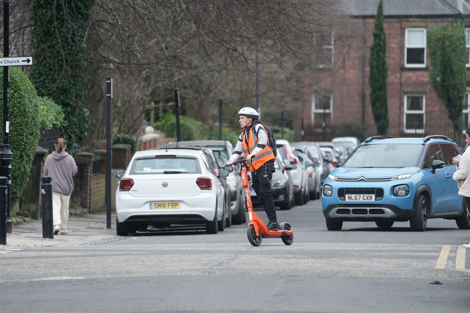 A man rides an e-scooter in Jesmond, Newcastle (Owen Humphreys/PA)
