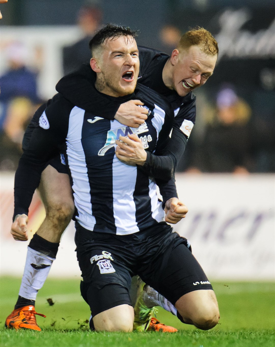 Darryl McHardy (left) celebrates Elgin City's dramatic equaliser against Stenhousemuir with team-mate Russell Dingwall. Photo: Bob Crombie