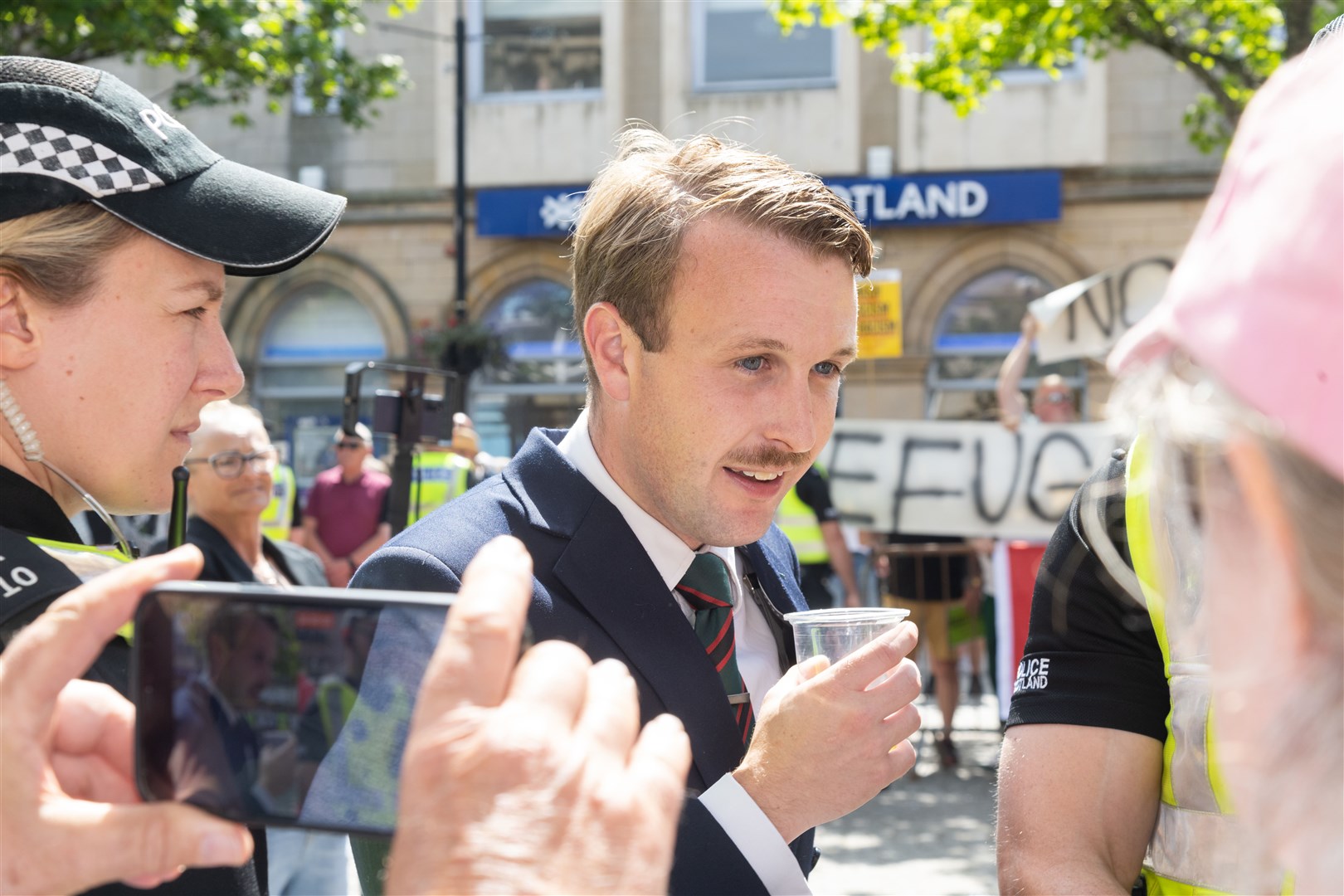 Alek Yerbury having a discussion with members of the public who gathered outside the St Giles Centre in Elgin where the Moray Trades Union Council (MTUC) held a vigil alongside a far-right rally...Picture: Beth Taylor.