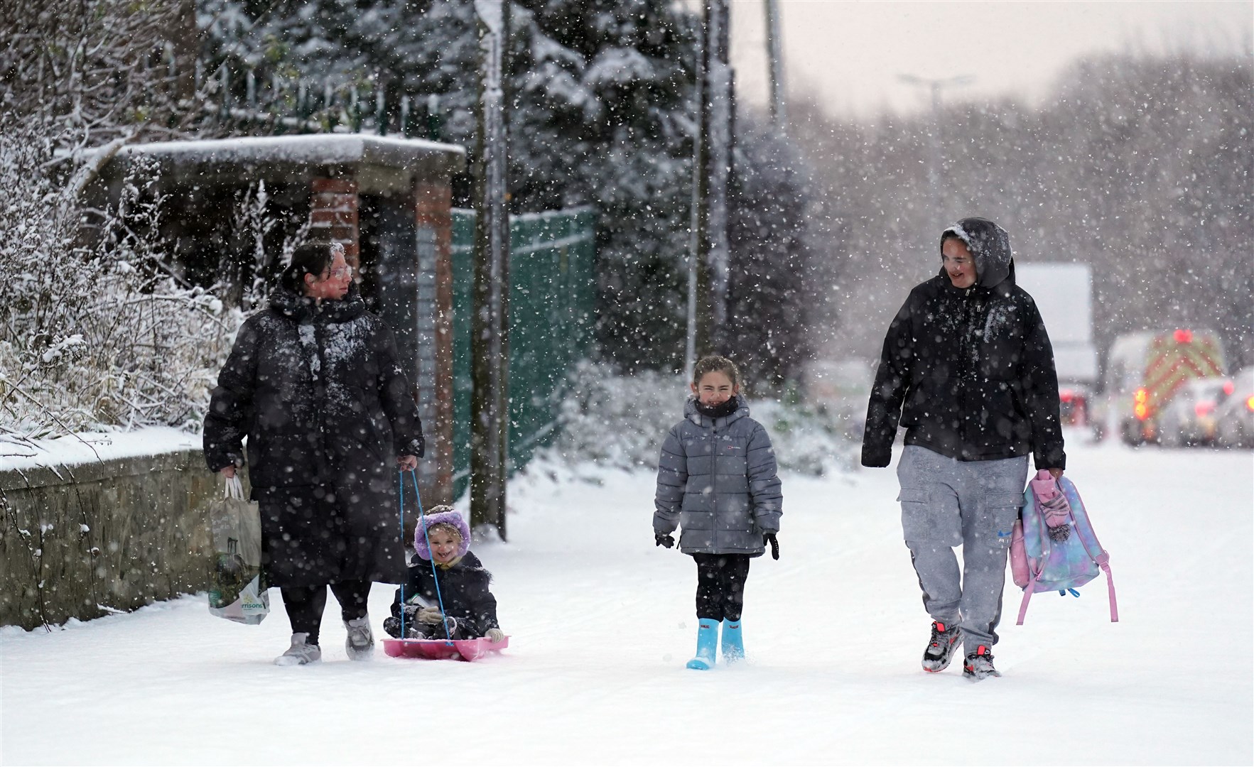 People in the snow in Gateshead (Owen Humphreys/PA)