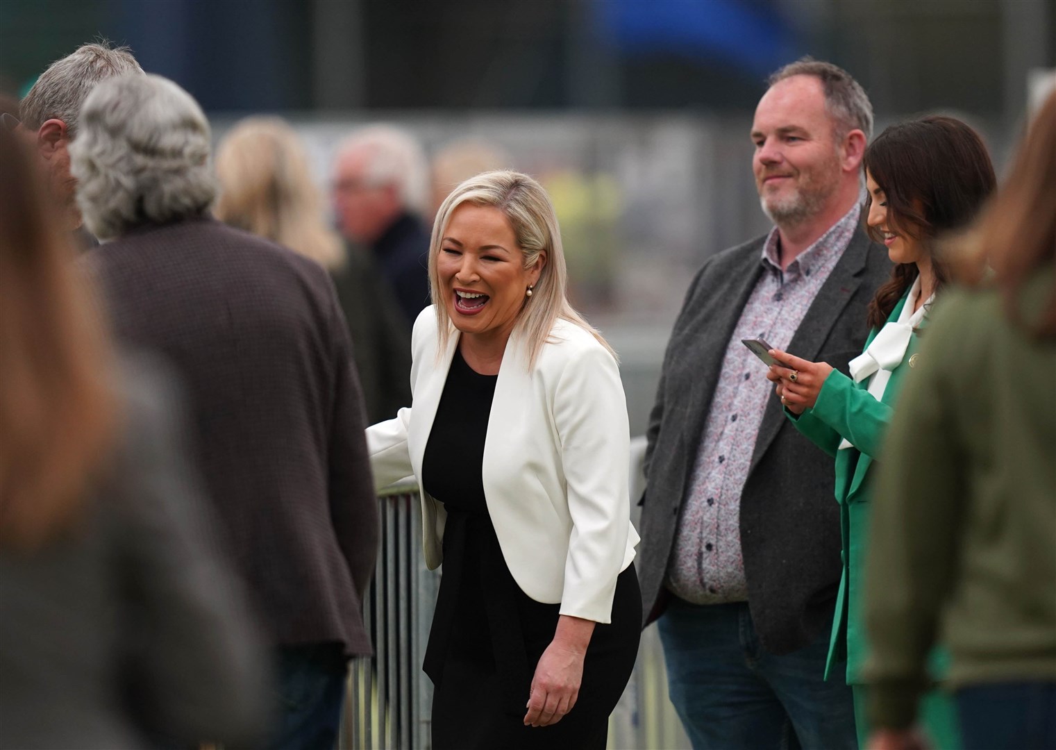 Sinn Fein’s Michelle O’Neill talks to party colleagues at Meadowbank sports arena (Niall Carson/PA)