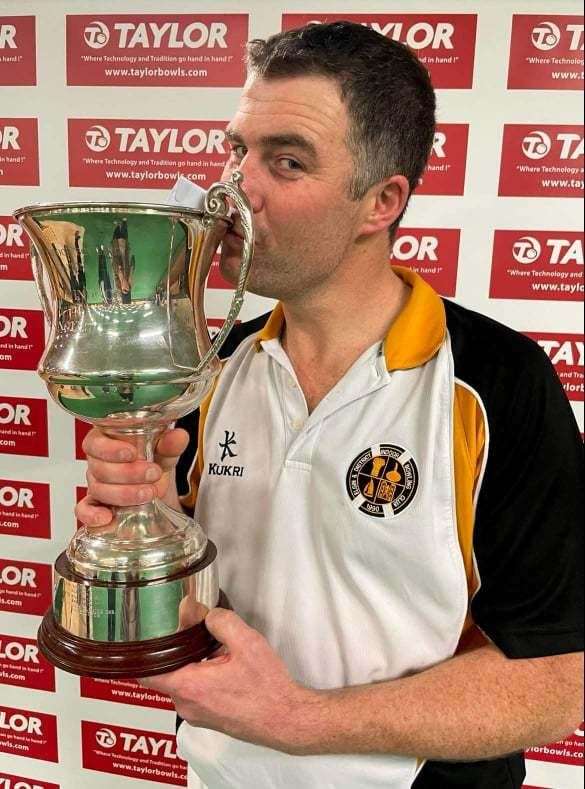 A kiss for the Scottish indoor trophyafter Stepney's triumph in December.