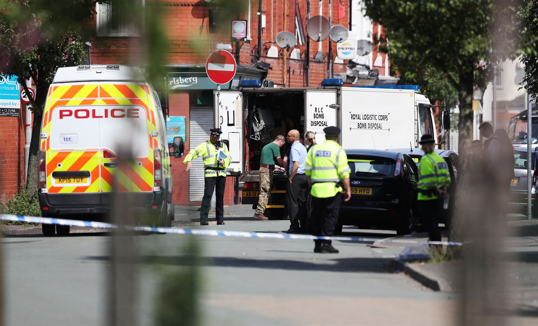 Police activity at a cordon in the Moss Side area of Manchester after the bombing (Jonathan Brady/PA)