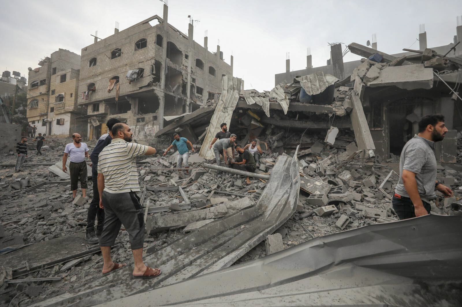 Palestinians search for survivors of the Israeli aerial bombing on Jabaliya, near Gaza City (AP)