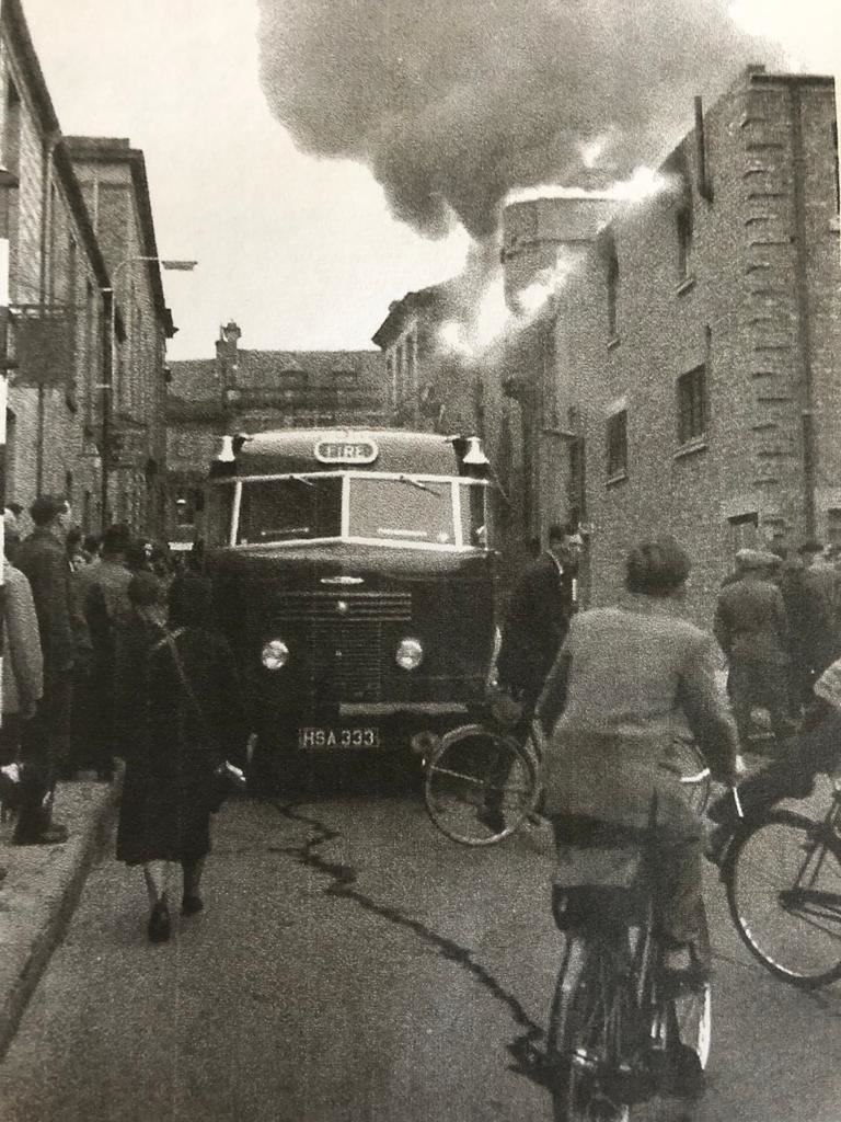 A crowded North Street in the 1950s as another fire rages.