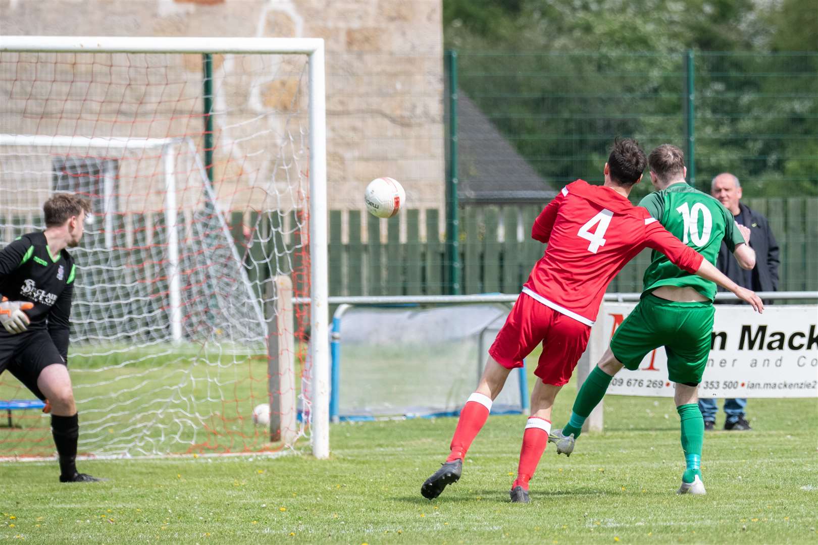 Forres goalkeeper Daniel McLeod is rooted to the spot as Dufftown #10 Ben Cullen scores the opener...Dufftown FC (2) vs Forres Thistle FC (2) - Dufftown FC win 5-3 on penalties - Elginshire Cup Final held at Logie Park, Forres 14/05/2022...Picture: Daniel Forsyth..