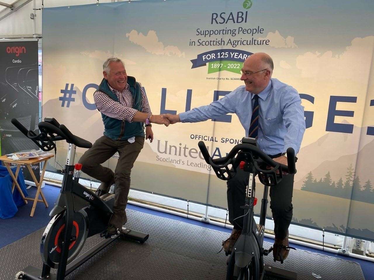 Aberdeenshire farmer Ken Howie (left) and Royal Highland Agricultural Society of Scotland chairman Bill Gray congratulate each other on their exertions for charity.