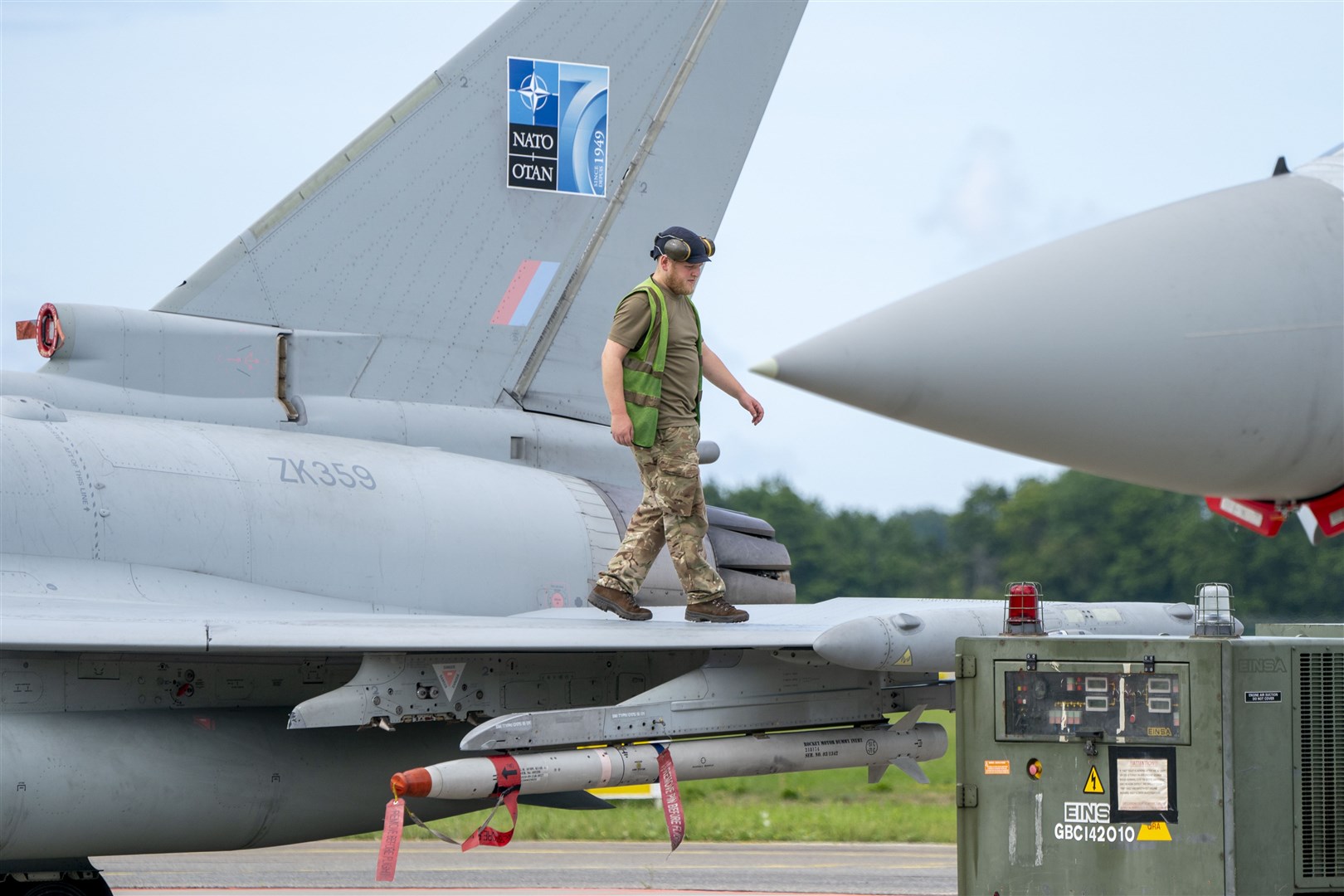 A member of the ground crew checks an RAF Typhoon jet after its return from exercise Jousten Strike at the Amari Airbase in Estonia (Jane Barlow/PA)