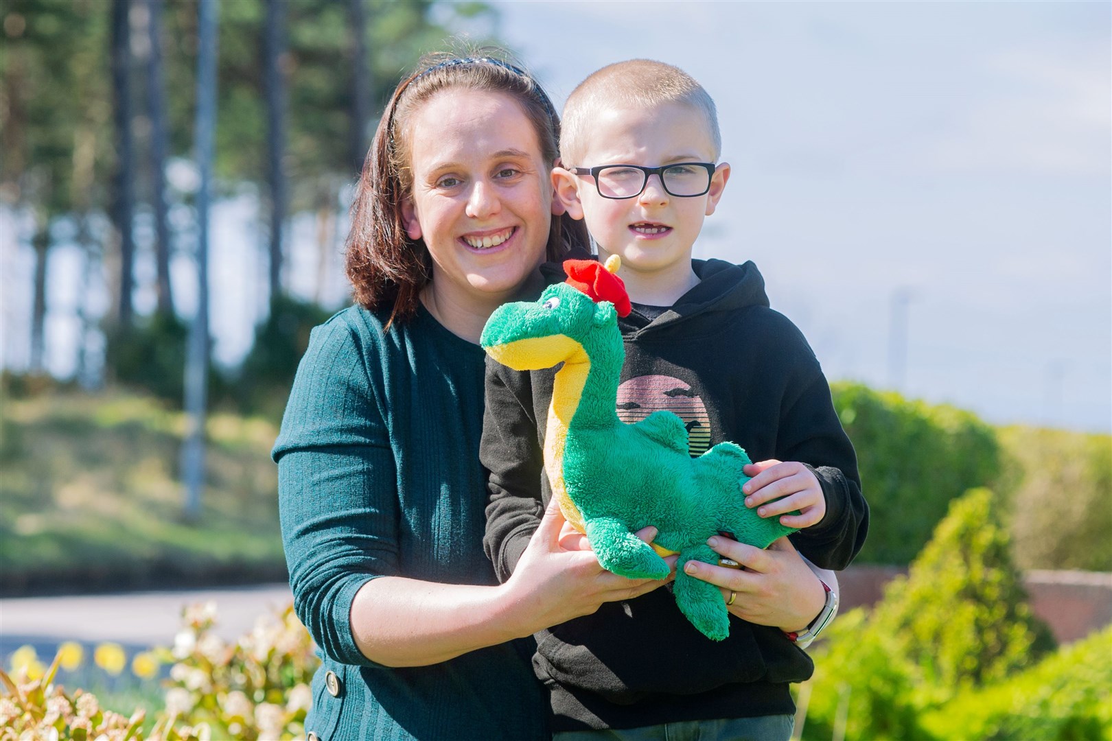 Marcus and his mother Gillian Vivian with some of their Loch Ness toys in their Burghead garden as the village has pulled together to display Loch Ness pictures in their window for Marcus to see...Picture: Daniel Forsyth..