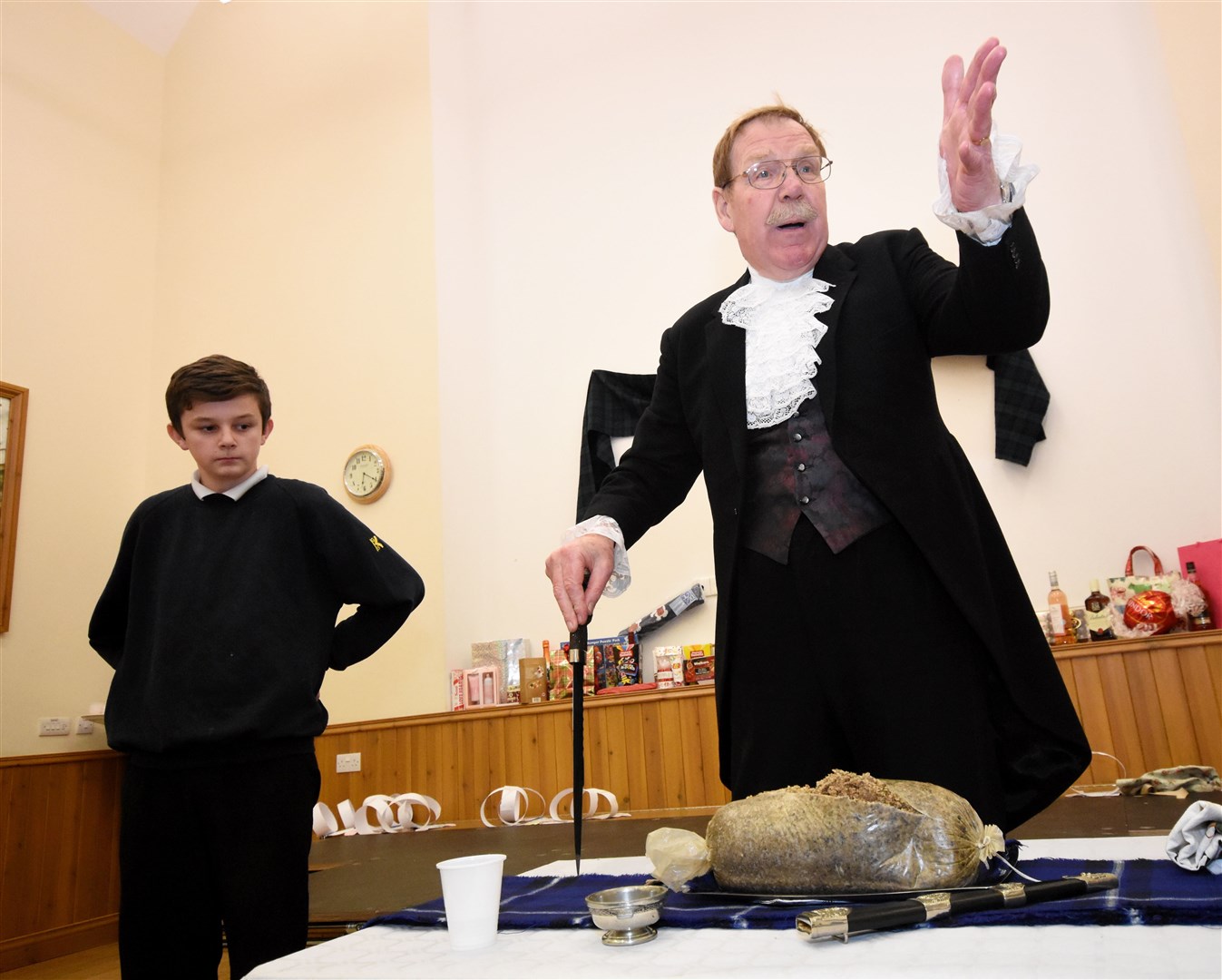 The late John Sievwright addressing the haggis at the Botriphnie Burns Supper.