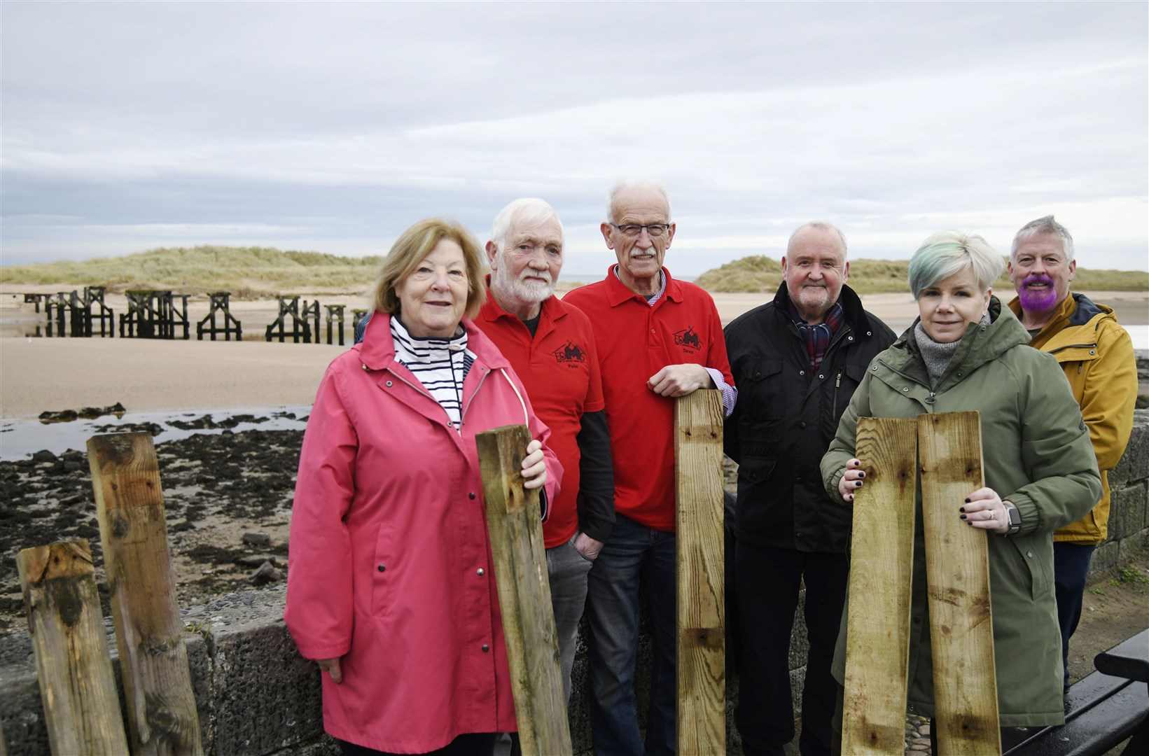 From left: Lily Mulholland, Pete Weatherhead, Davie Bain (Elgin Men's Shed), Rab Forbes (Lossiemouth Community Development Trust), Donna McLean (Memeber of Lossiemouth Business Association) and George McLean are selling parts of the old bridge at Lossiemouth for charities...Picture: Beth Taylor.