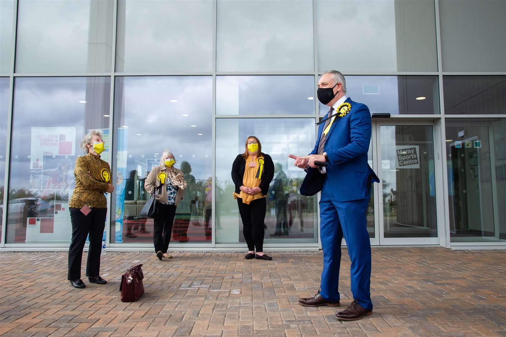 Richard Lochhead, Moray's SNP MSP, is greeted by his campaign team as he arrives at the Regional Count on Saturday morning following a period of precautionary self-isolation...Moray's 2021 Scottish Election...Picture: Daniel Forsyth.
